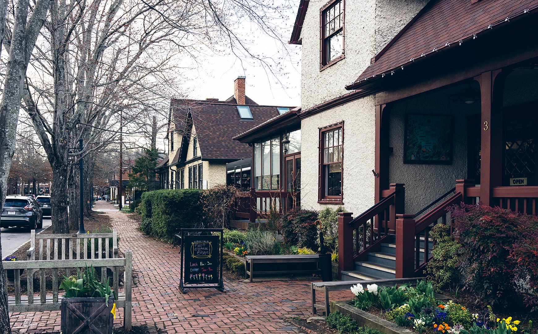 Brick sidewalk and Tudor-style shopfronts in Biltmore Village, a short drive from Kenilworth