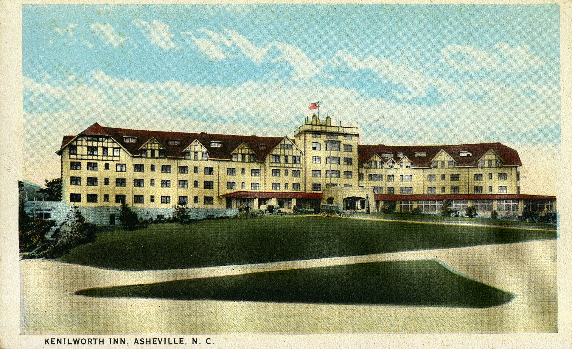 Hand-tinted vintage postcard of the Kenilworth Inn, a long Tudor Revival hotel with a lawn in front